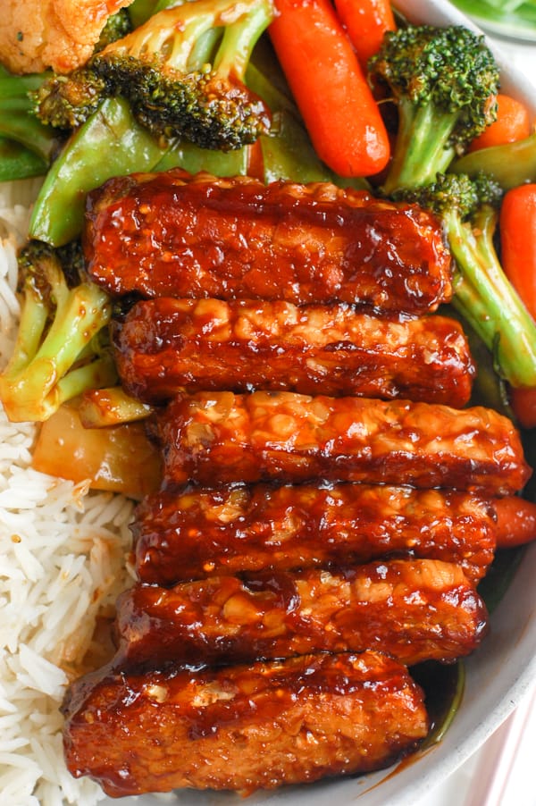 bbq baked tempeh in dish with veggies