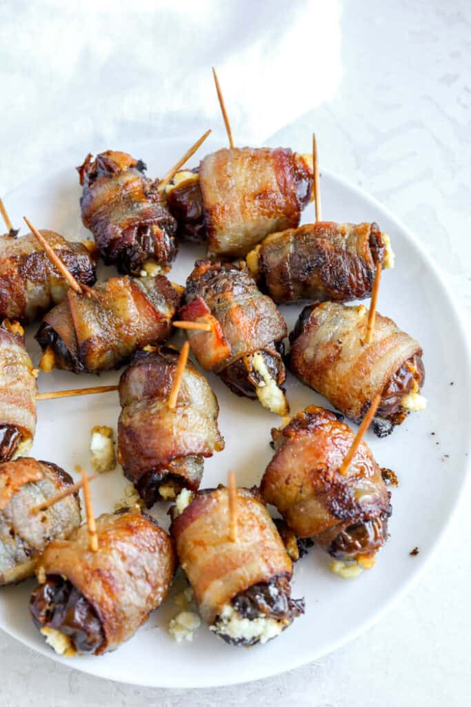 Plate of bacon wrapped stuffed dates