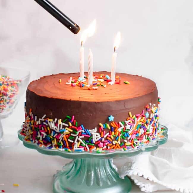lighting candles on healthy birthday cake