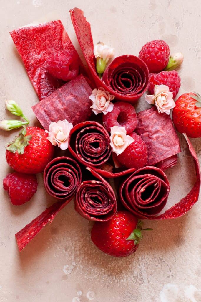 healthy homemade fruit roll ups with strawberries and raspberries