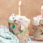 birthday cake overnight oats in cup with candle
