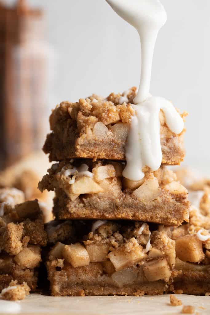 stack of apple pie bars with icing