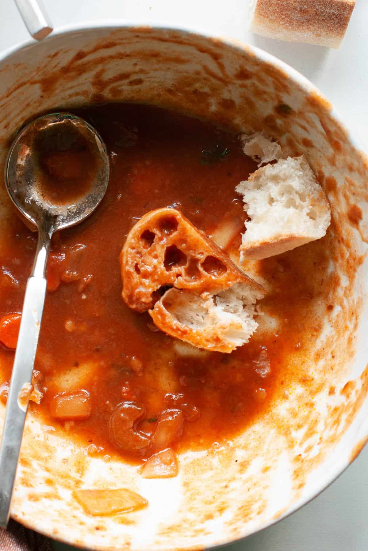 ends of beef stew in bowl with bread