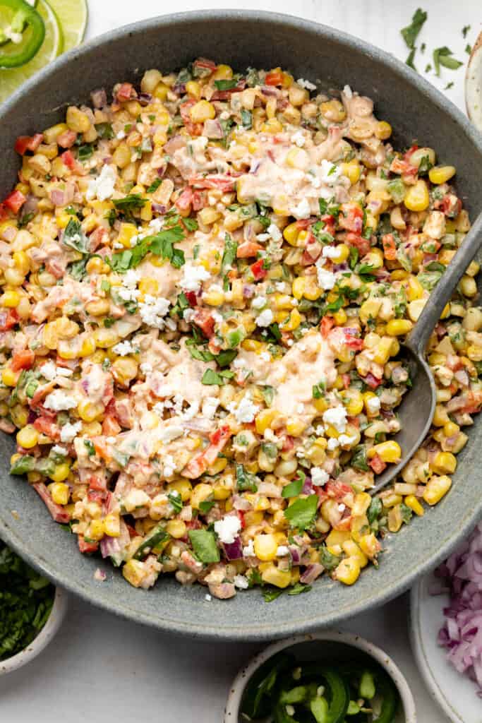 corn salad in a bowl with a spoon