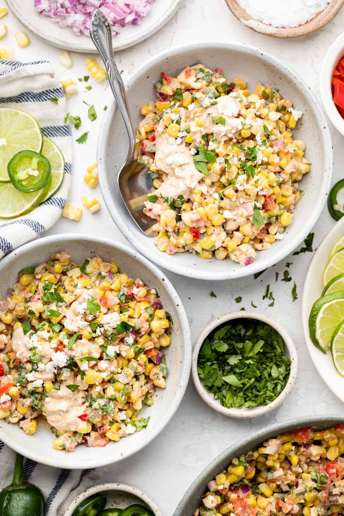 corn salad in a bowl with a spoon