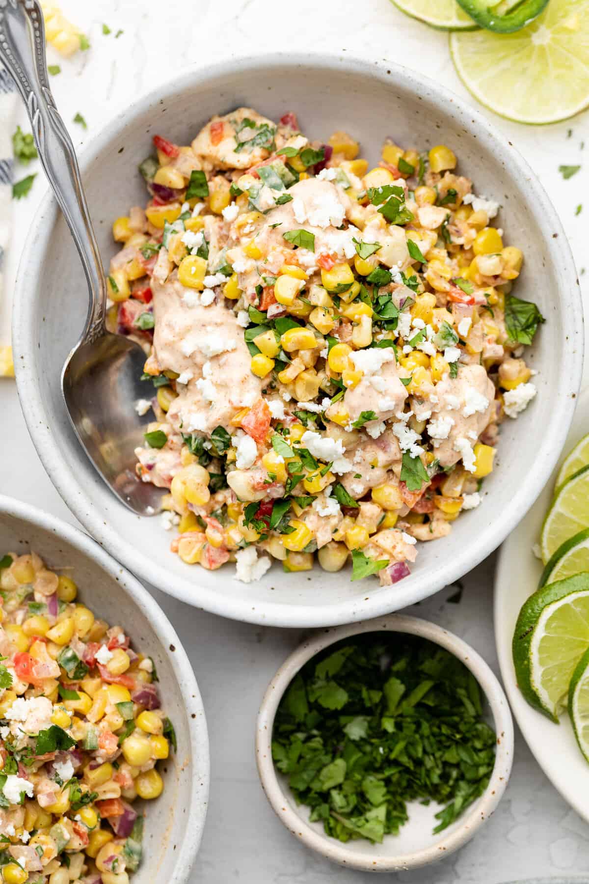 corn salad in a bowl with a spoon