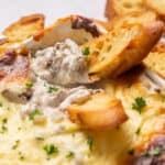 Philly cheesesteak dip with slide of bread