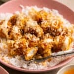 crispy chicken with sauce on rice in bowls