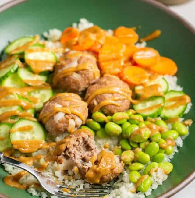 turkey meatballs with edamame, carrots, cucumber, rice, and peanut sauce