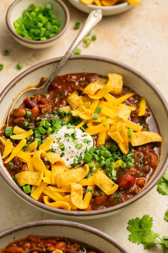beef chili with cheese in bowls