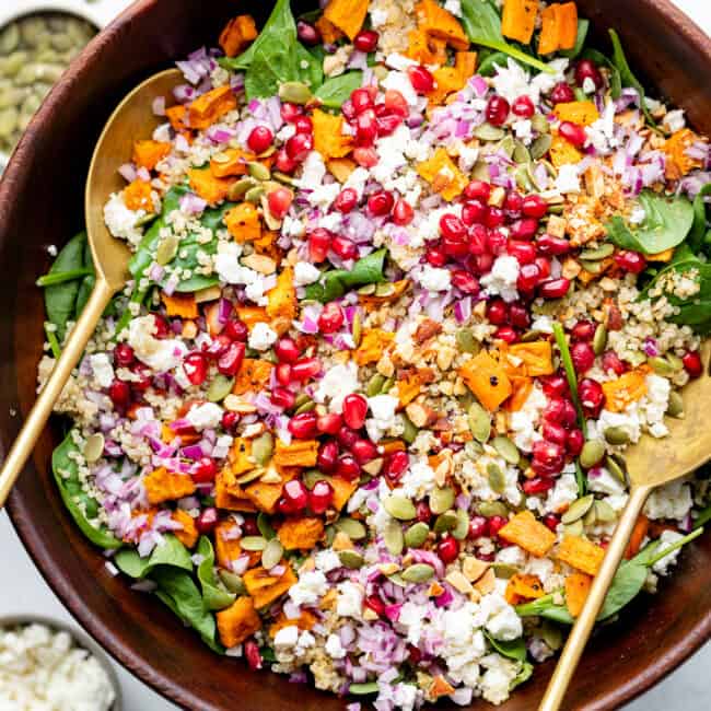 fall harvest quinoa salad in large bowl with serving spoons