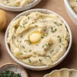 mashed potatoes in bowl with butter and chives