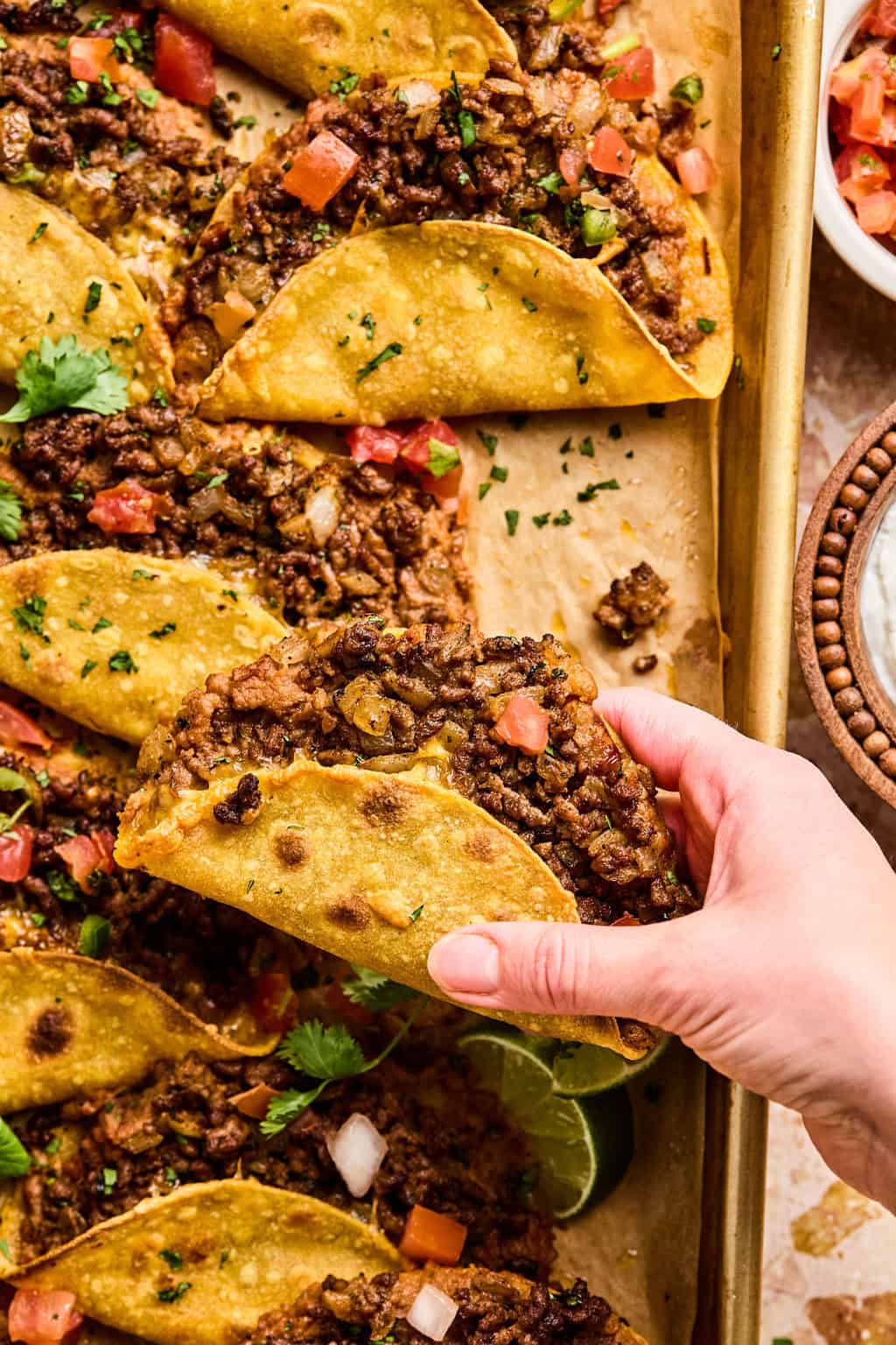 Hand holding Oven Baked Beef Tacos