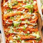 High Protein Buffalo Chicken Enchiladas in casserole dish