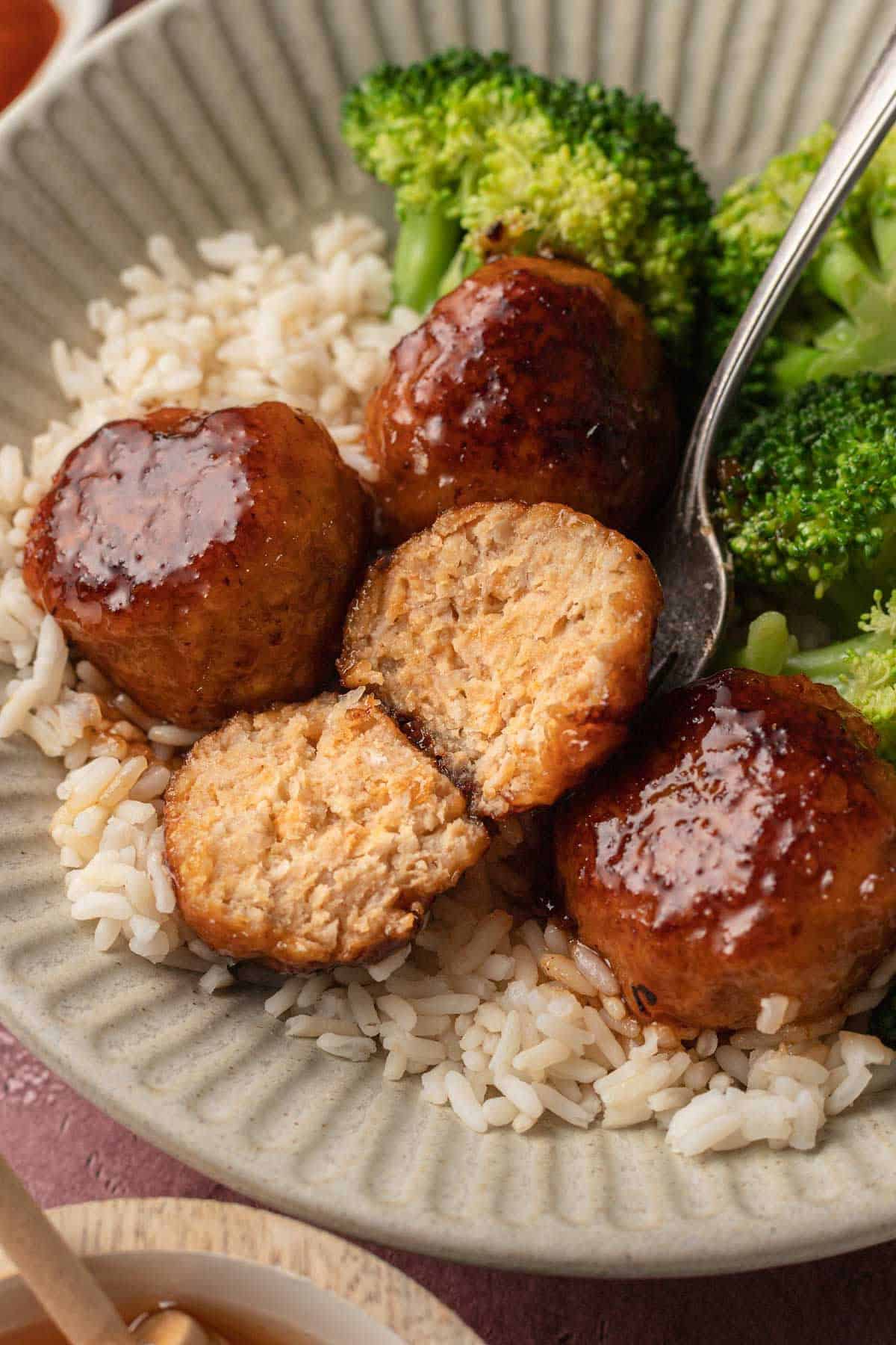 Hot Honey Meatballs on plate with broccoli and rice