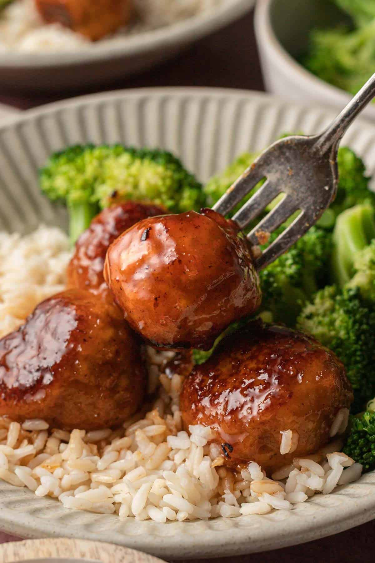 Hot Honey Meatballs on plate with broccoli and rice