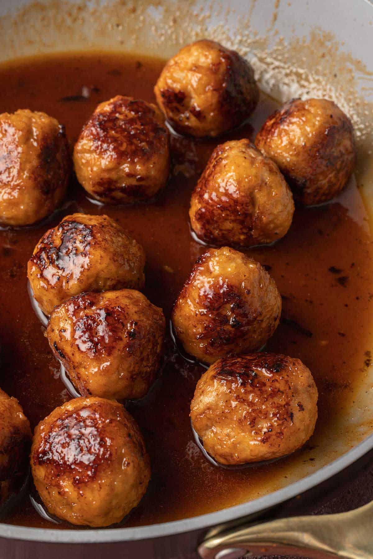 meatballs in hot honey sauce in pan
