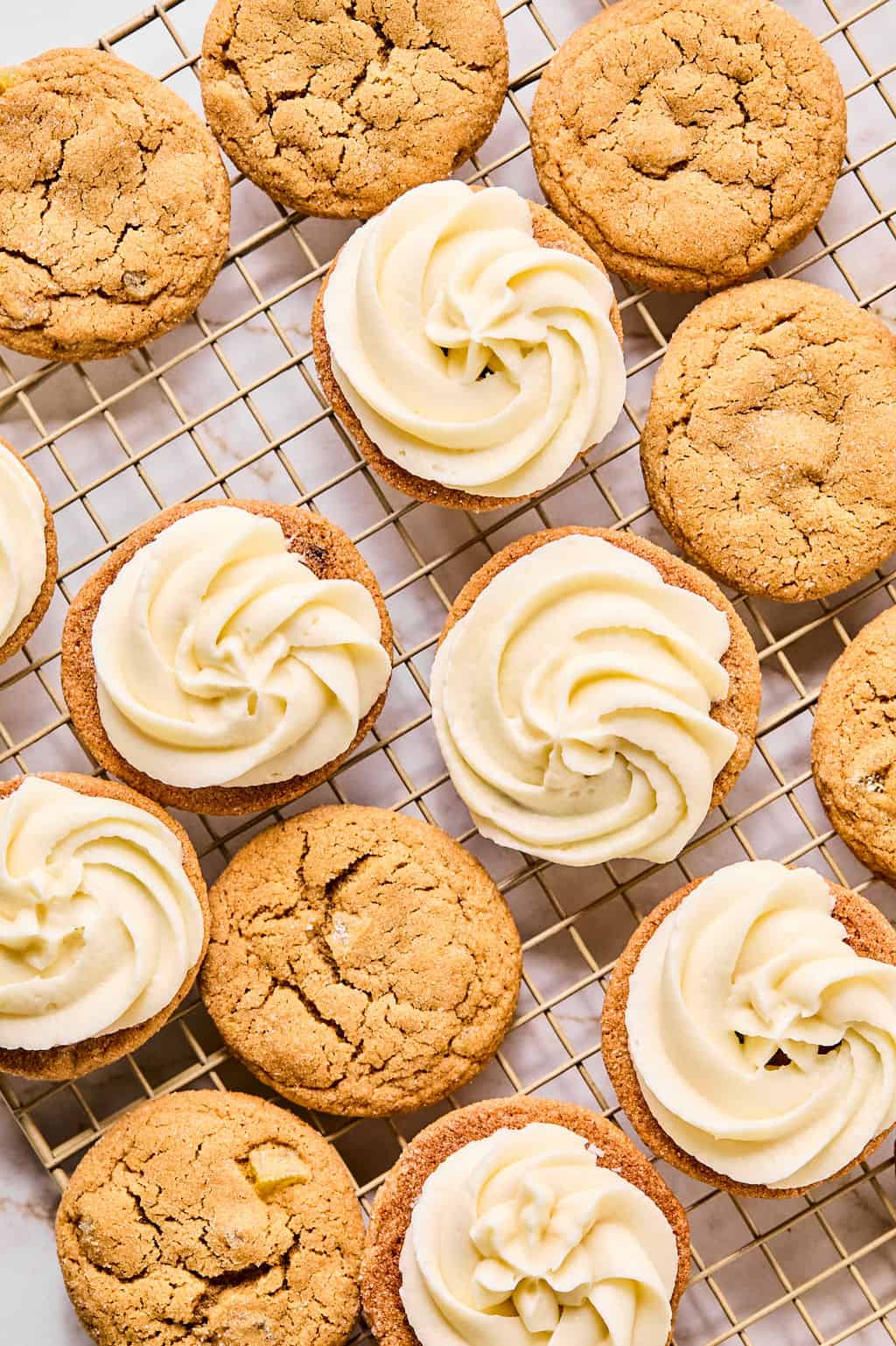 Cookies with icing on them on cooling rack