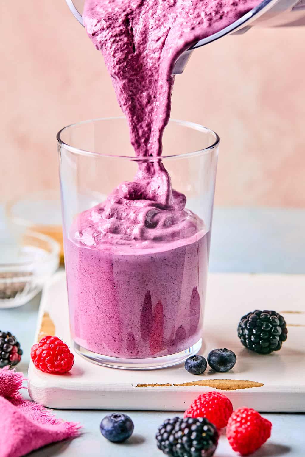 Pouring the Berry Protein Smoothie in cup
