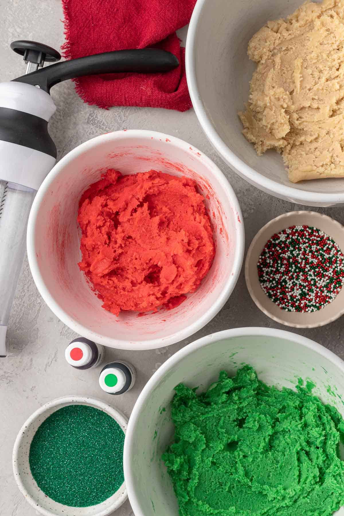 Dyed cookie dough in bowls