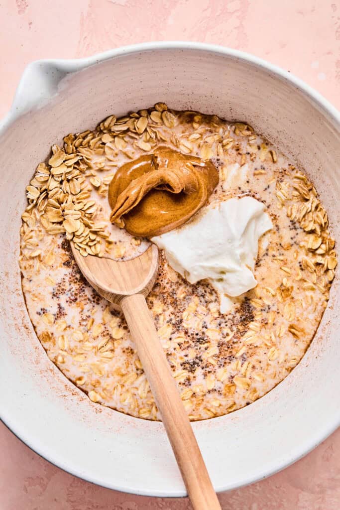 Almond butter, maple syrup, almond milk, cottage cheese, and vanilla added to large bowl