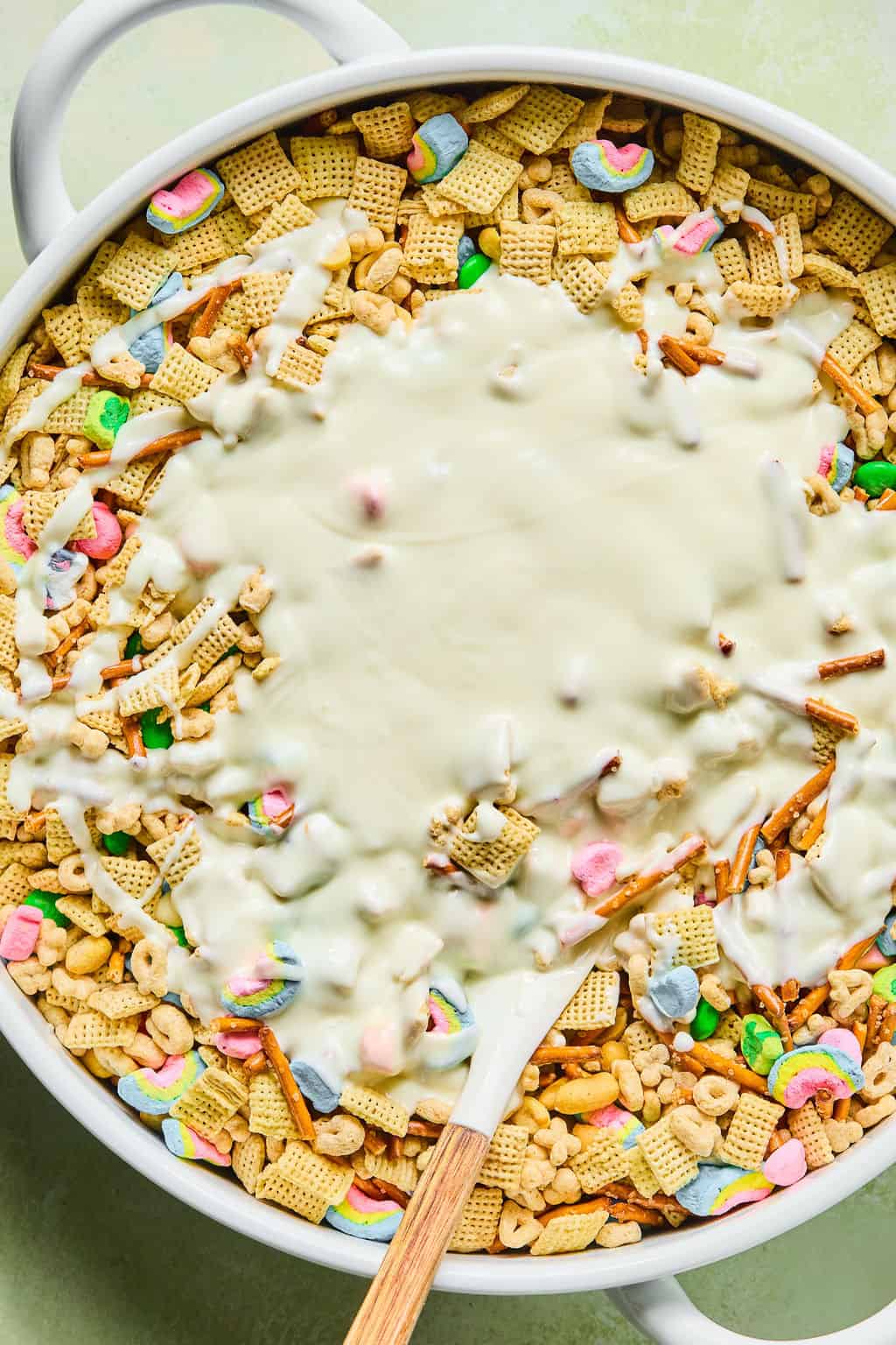 white chocolate poured onto dry ingredients in bowl