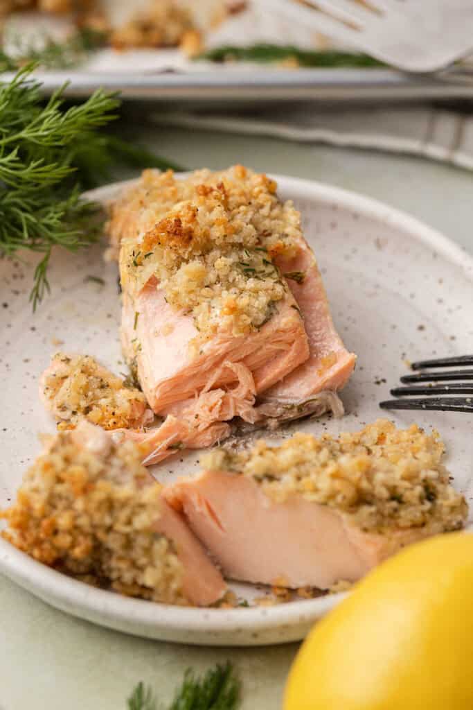 baked dill salmon fillet cut apart with a fork