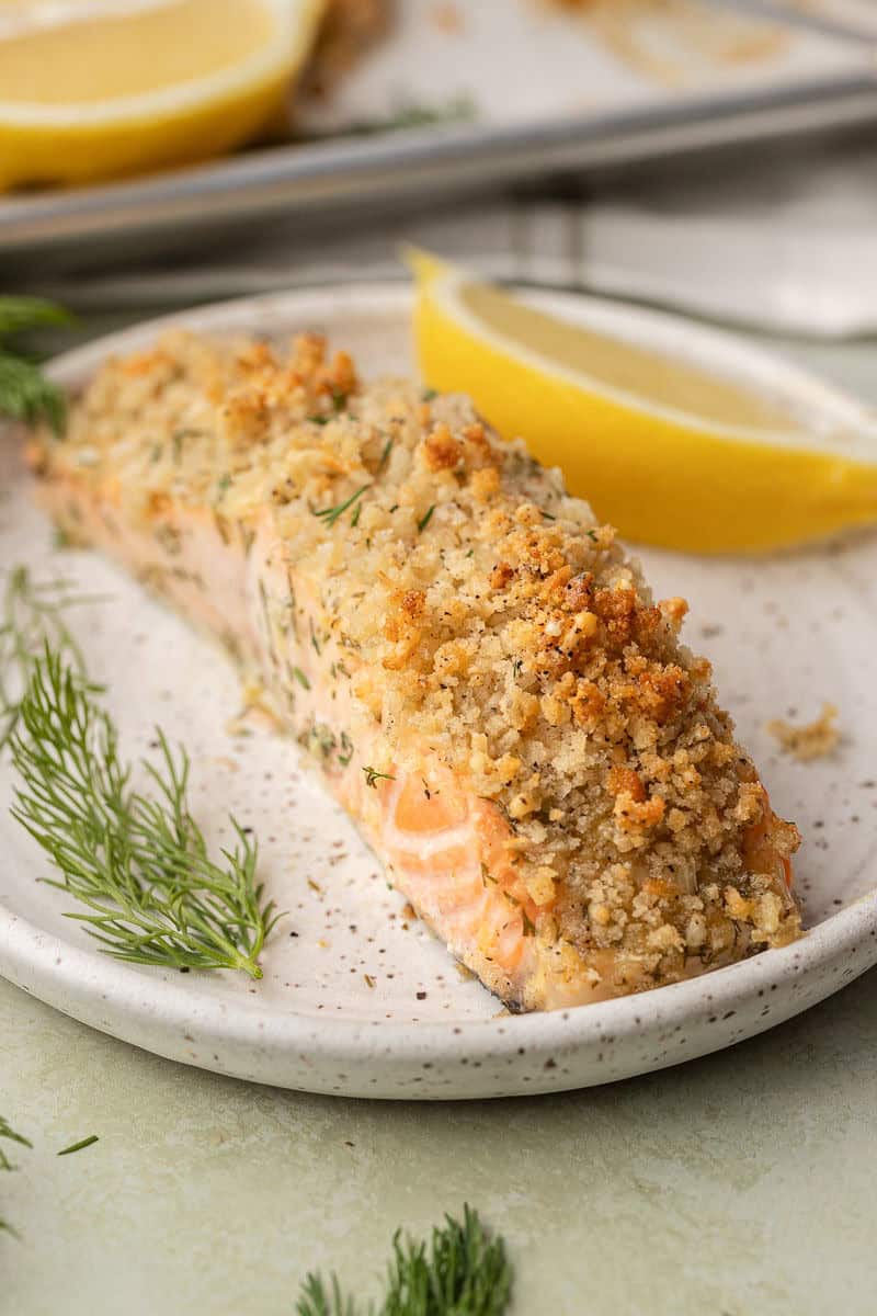 panko crusted salmon garnished with lemon and dill
