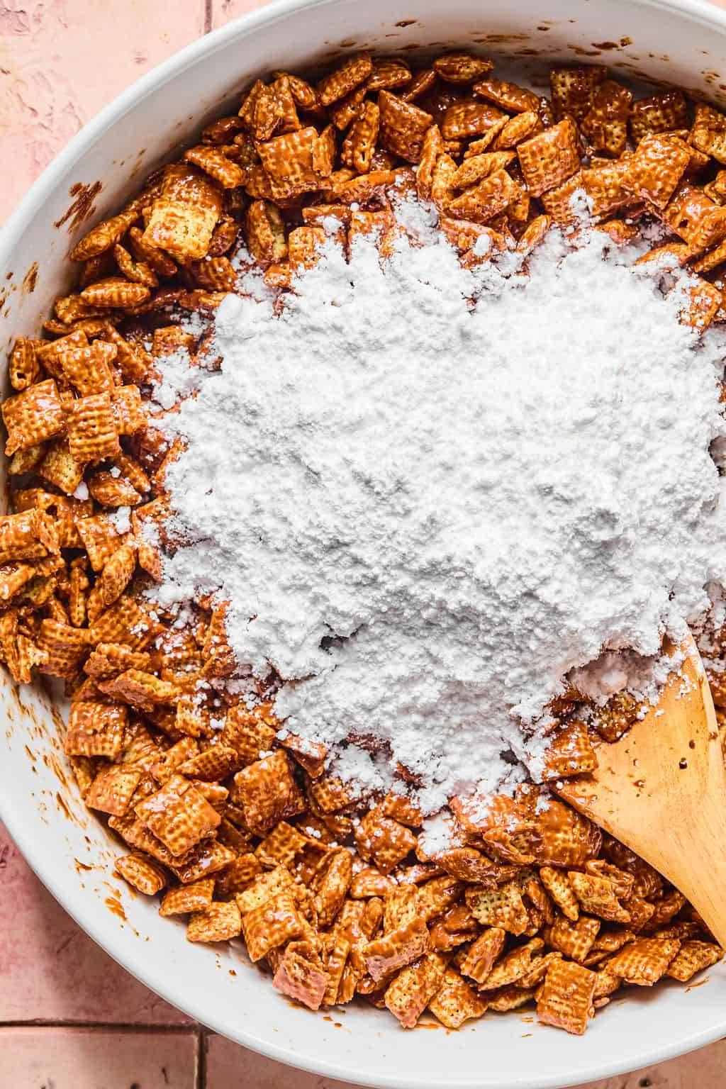 Powdered sugar on top of chex mixture
