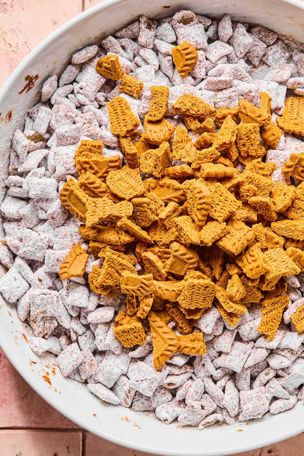 Adding in crushed Biscoff cookies