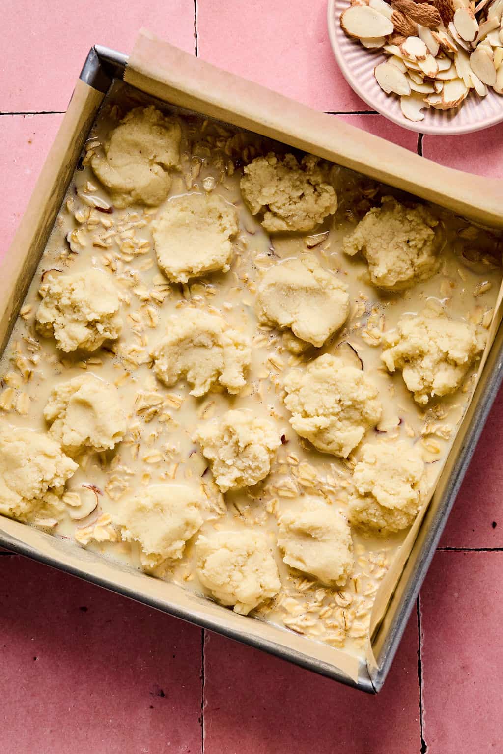 almond topping added to top of Almond Croissant Baked Oatmeal mixture
