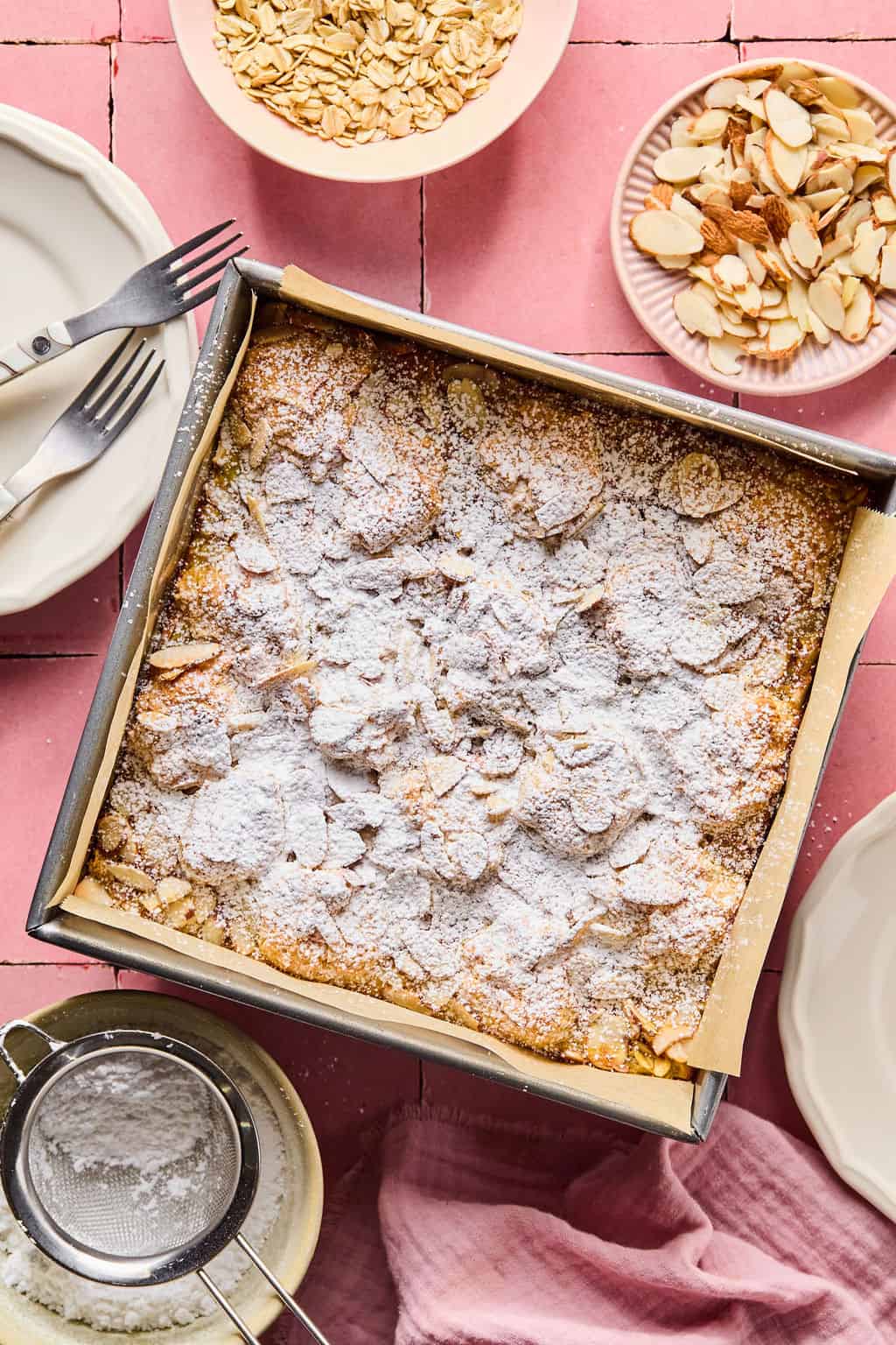Almond Croissant Baked Oatmeal with powdered sugar on top