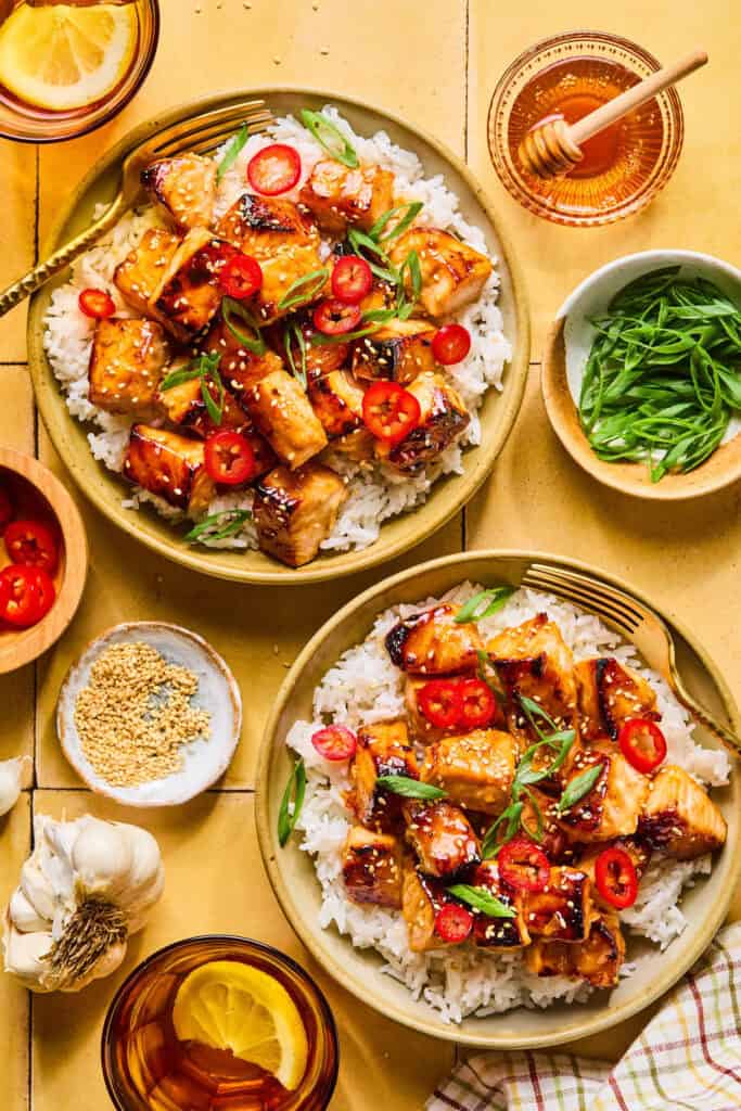 Honey Glazed Salmon Bites on rice in bowls