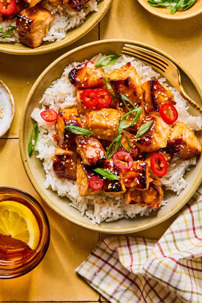 Honey Glazed Salmon Bites on rice in bowls