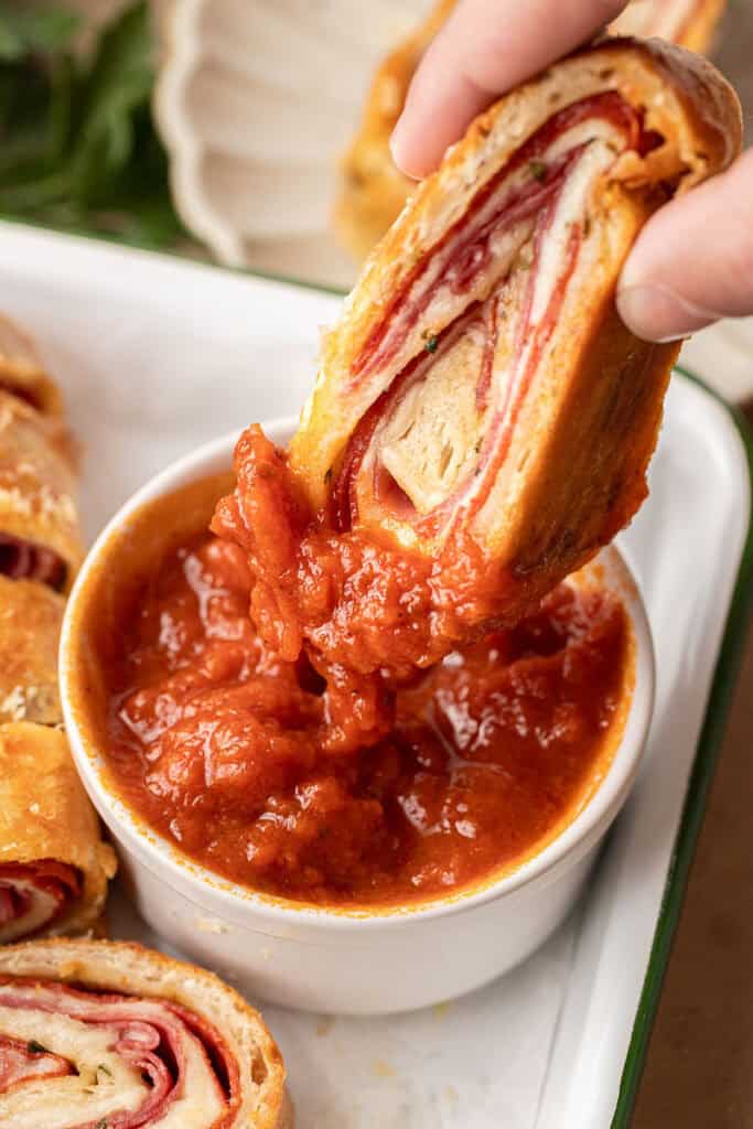 Italian Stromboli dipped in marinara sauce