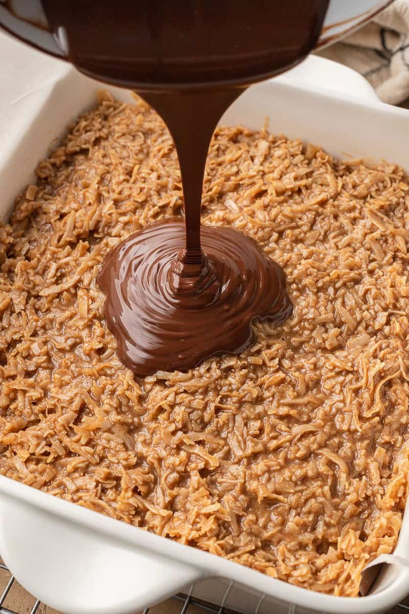 melted chocolate chips poured over samoa mixture