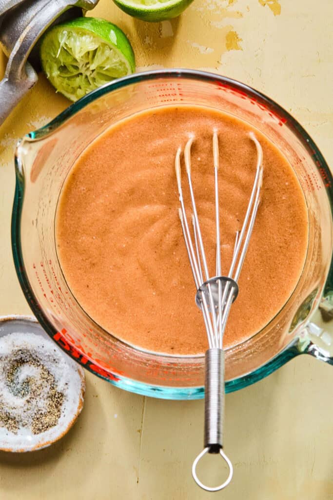 Dressing ingredients mixed in glass measuring cup