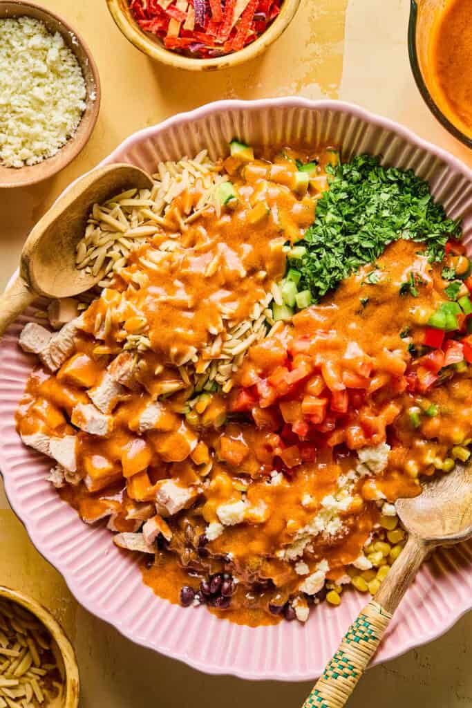 Southwest Chopped Chicken Salad ingredients in bowl with dressing