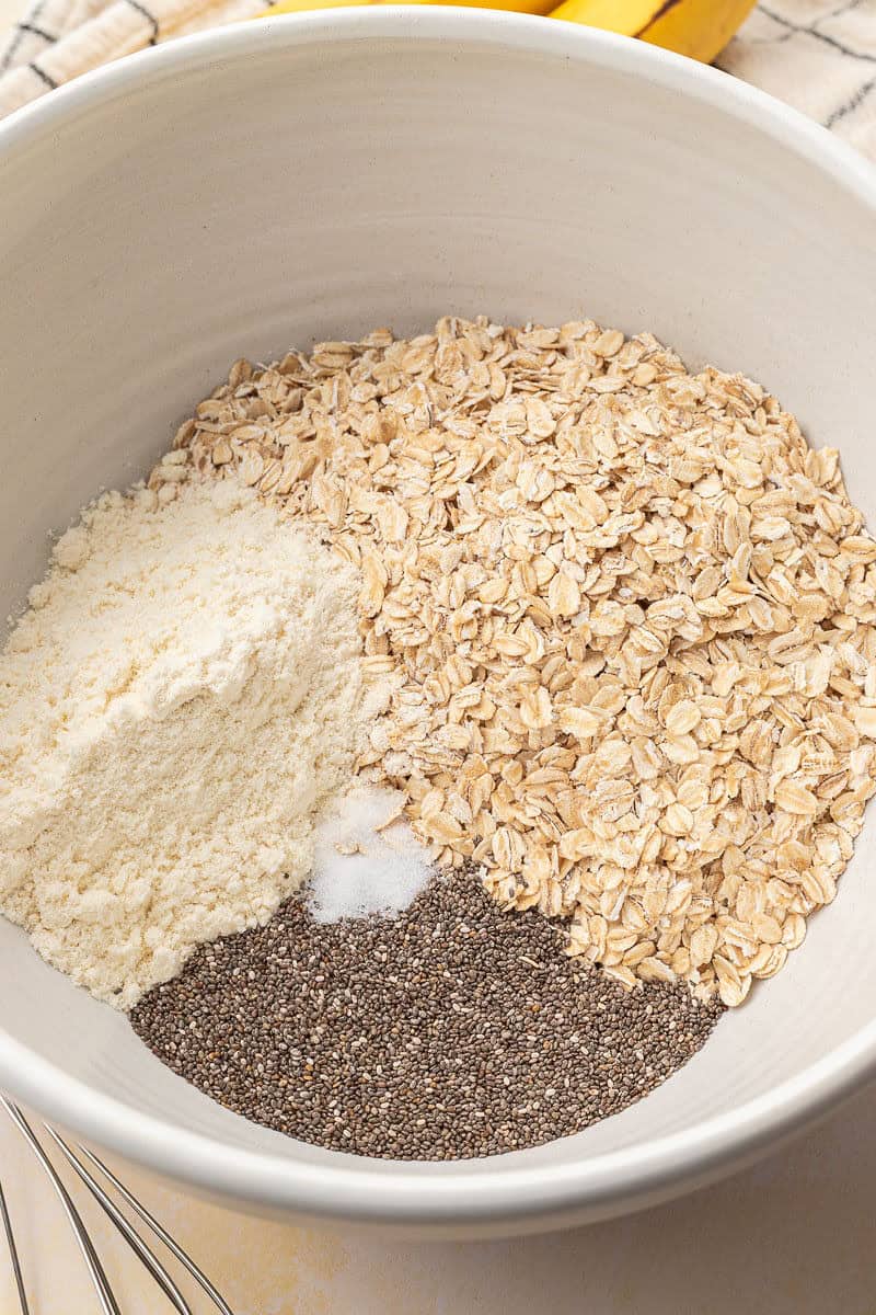 Oats, protein powder, chia seeds, and salt in large bowl