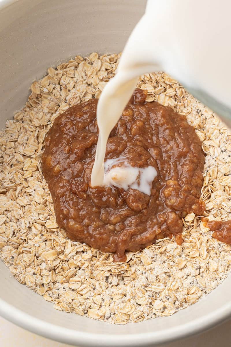Pouring almond milk into large bowl
