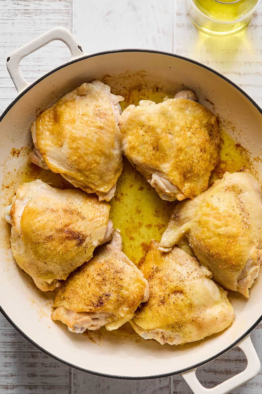 Cooked chicken thighs in pan