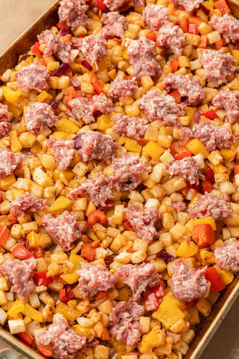 Dollops of sausage on top of sheet pan