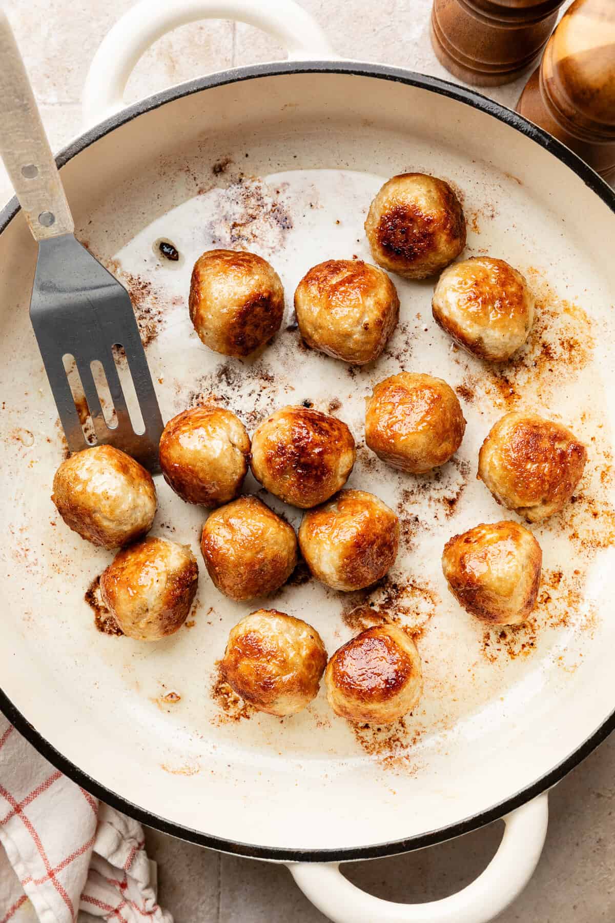 Meatballs in pan.