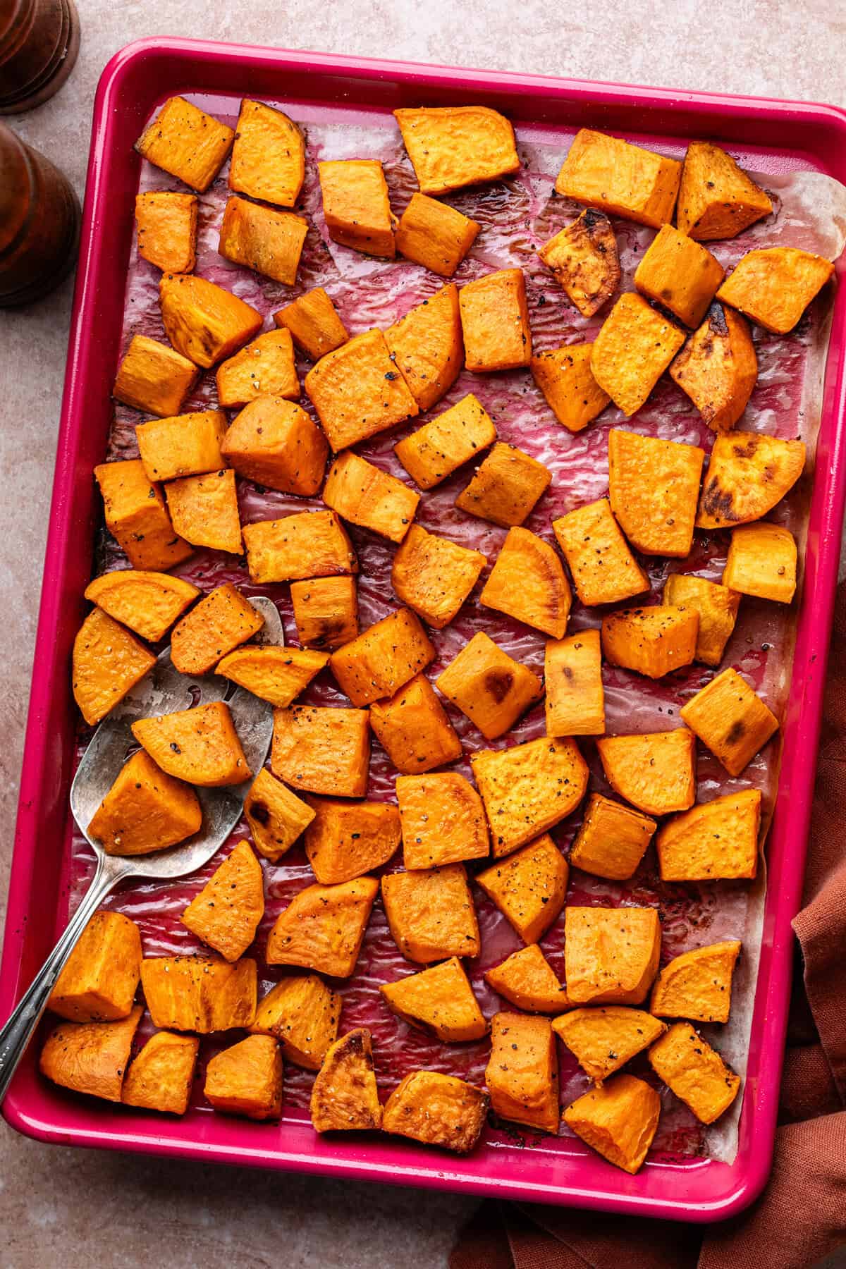 Cooked sweet potatoes on pan.