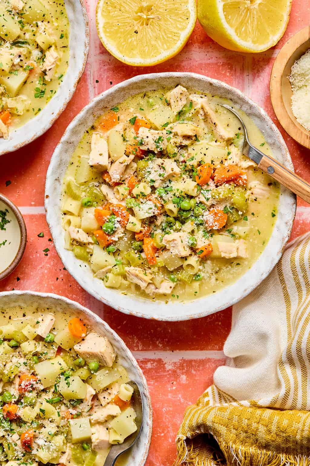 Creamy Chicken Soup in bowls with spoon.