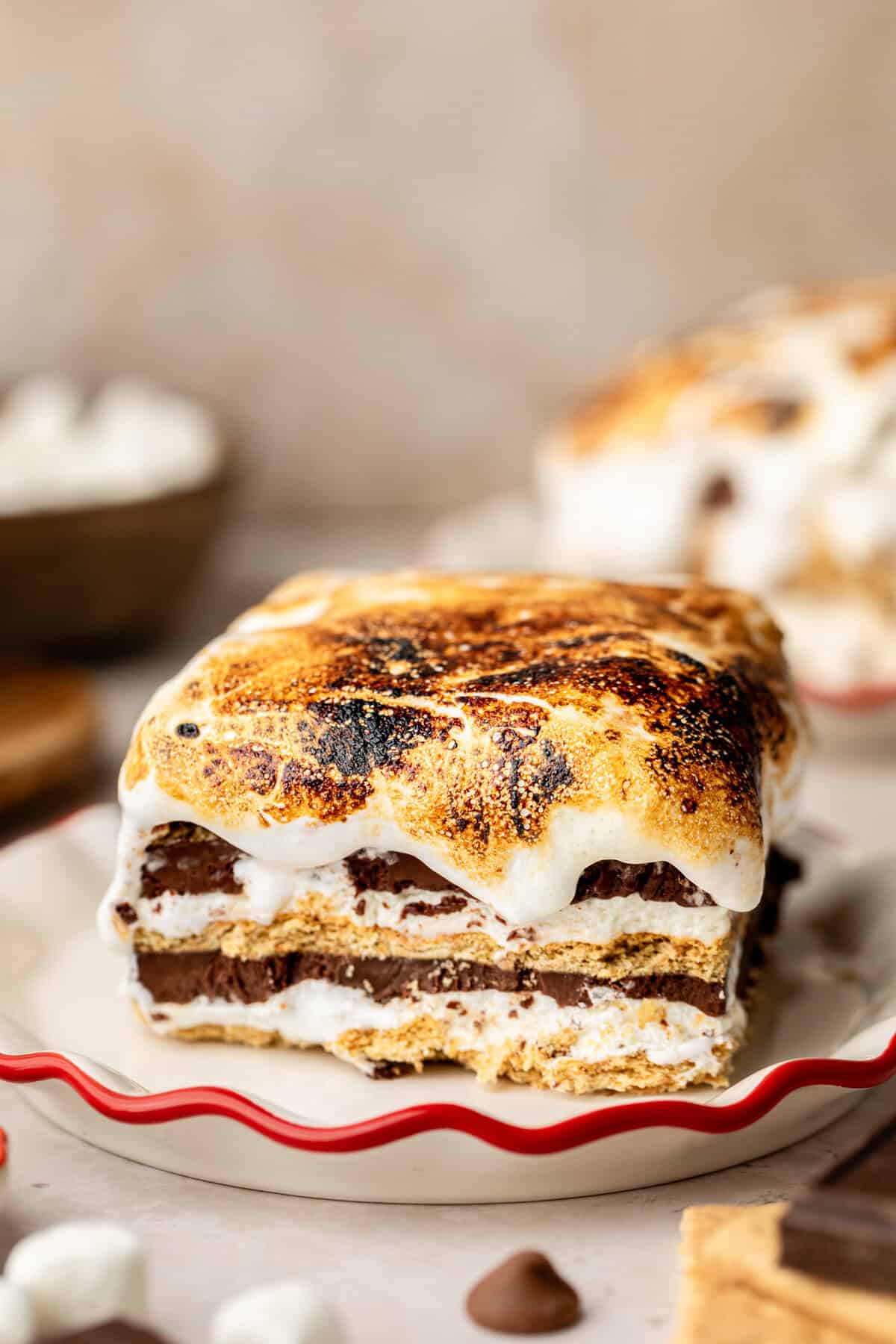 Slice of S'mores Icebox Cake on white plate.