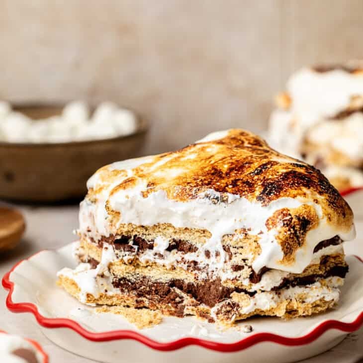 Slice of S'mores Icebox Cake on white plate.