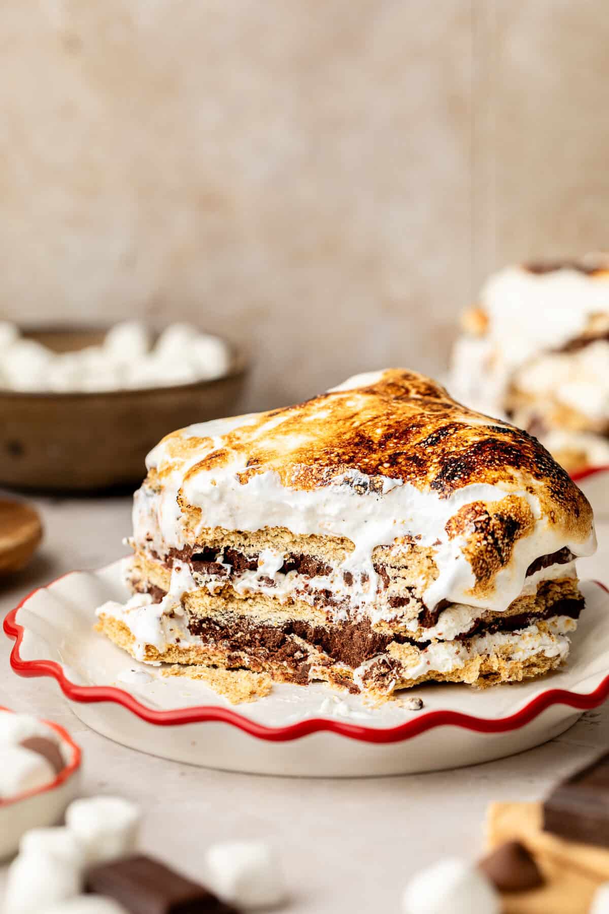 Slice of S'mores Icebox Cake on white plate.