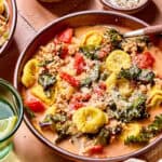 Spicy Sausage Tortellini Soup in bowl with spoon.