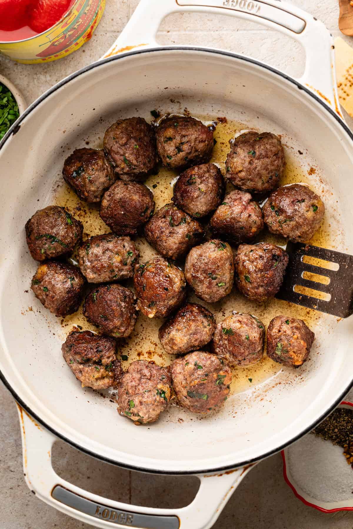 Meatballs in sauce pan.